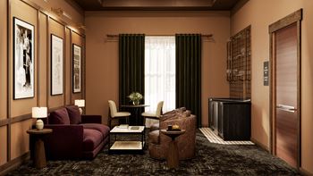 a living room with a couch and chairs and a tv